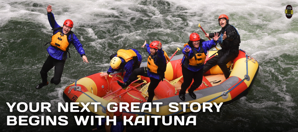 Team in safety gear paddling a red raft at Kaituna Rafting, starting an epic adventure.