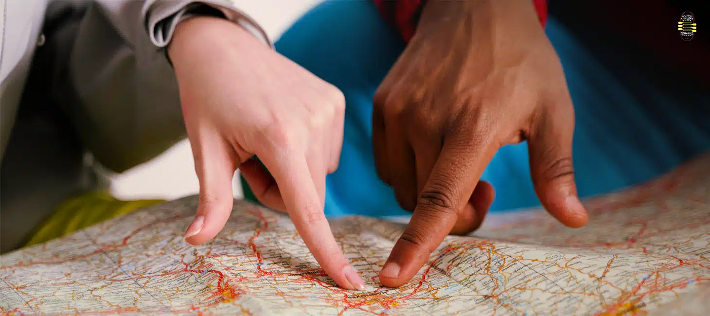 Planning a Rotorua road trip route on a map before a kaituna river rafting adventure